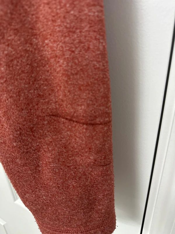 red Weird Fish quarter-zip jumper with a distinctive fish-shaped zipper pull.