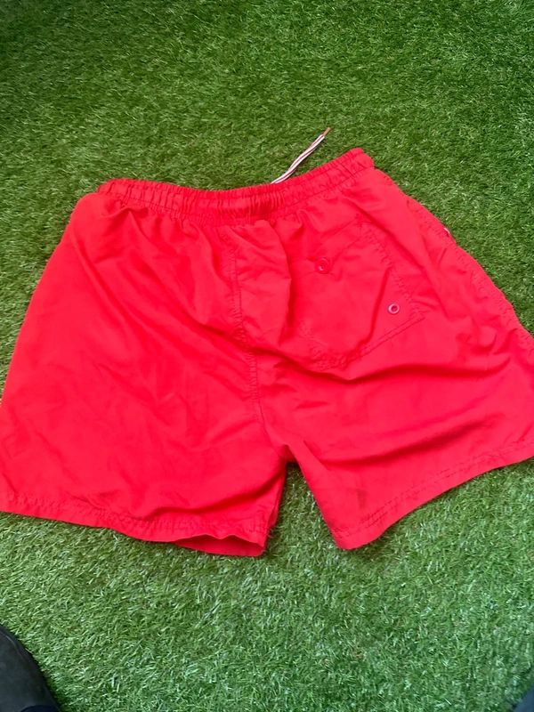 Men’s red swim shorts in size large