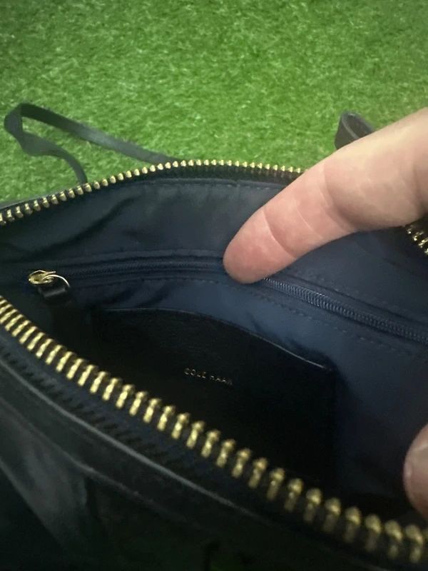 Cole Haan black zip crossbody bag with front stripe detail