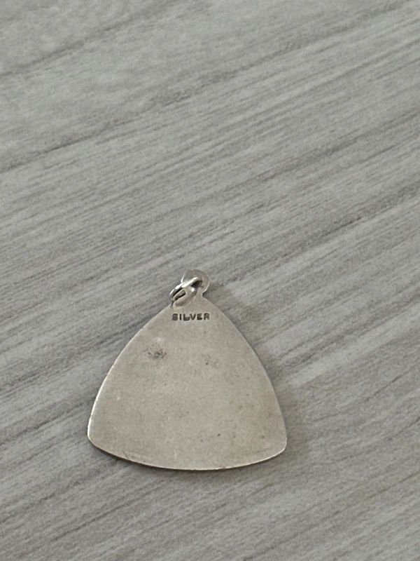 vintage sterling silver St. Christopher pendant features a rare triangular shape