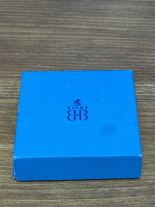 Vintage rhinestone brooch in a Birks box