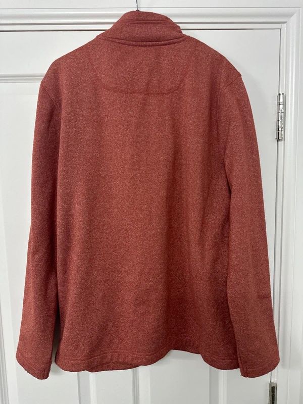 red Weird Fish quarter-zip jumper with a distinctive fish-shaped zipper pull.