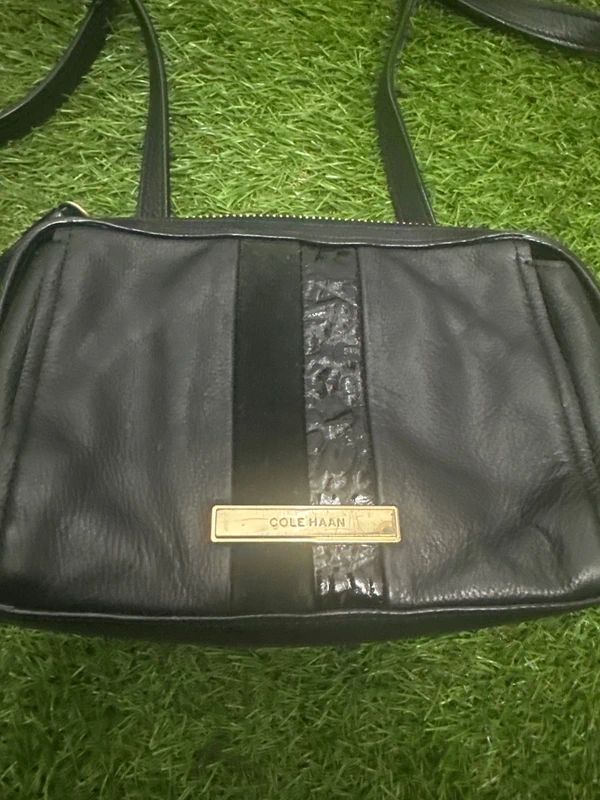 Cole Haan black zip crossbody bag with front stripe detail