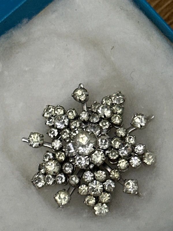 Vintage rhinestone brooch in a Birks box