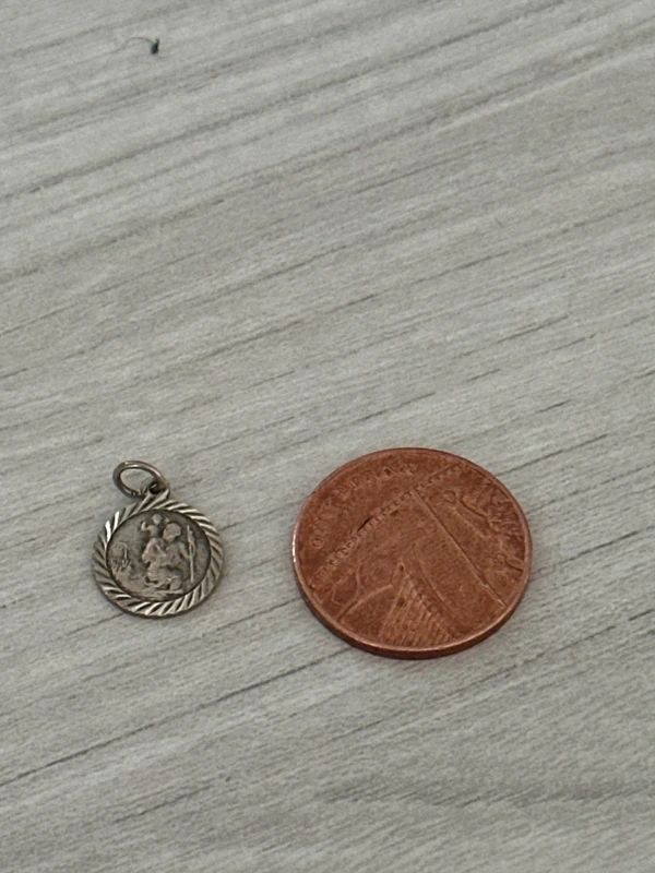 sterling silver Saint Christopher pendant features a textured rope border