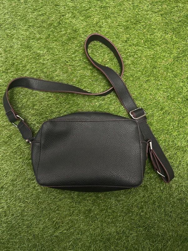 U.S. Polo Assn. black crossbody bag with zip closure