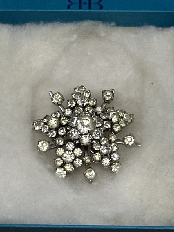 Vintage rhinestone brooch in a Birks box