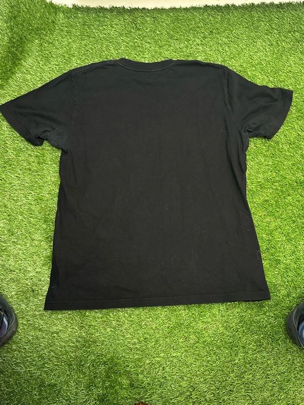 black Carhartt WIP Fading Script T-shirt features a lime green graphic logo print on the front