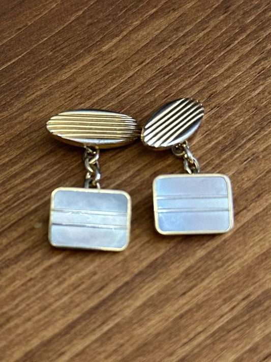 vintage 1970s cufflinks feature a distinct striped design on the face