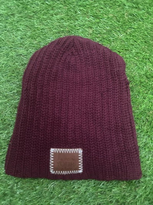 burgundy Love Your Melon beanie features a signature stitched leather logo patch