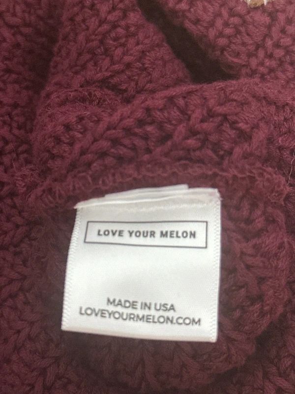 burgundy Love Your Melon beanie features a signature stitched leather logo patch