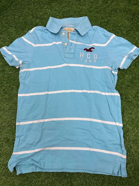Hollister polo shirt with stripes and "HCO 1922" branding on the chest. Small