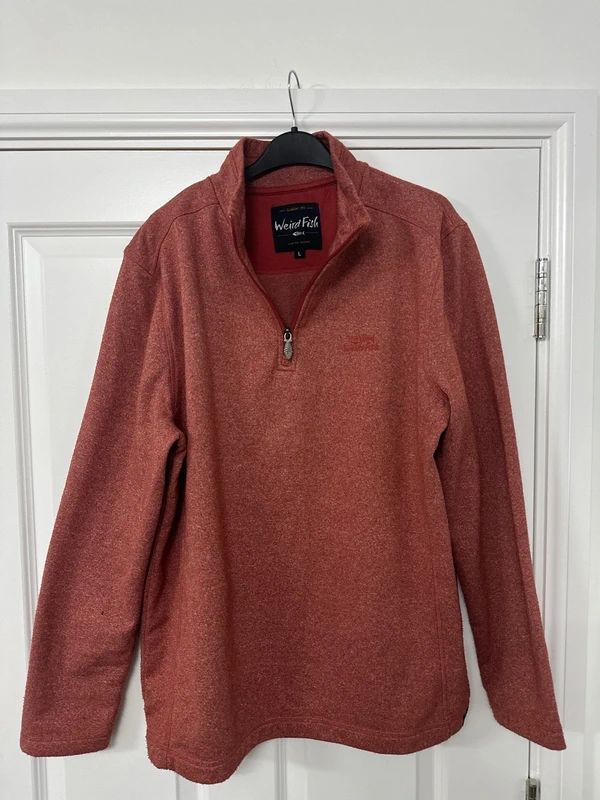 red Weird Fish quarter-zip jumper with a distinctive fish-shaped zipper pull.