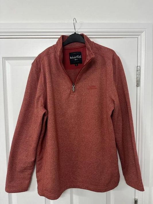 red Weird Fish quarter-zip jumper with a distinctive fish-shaped zipper pull.
