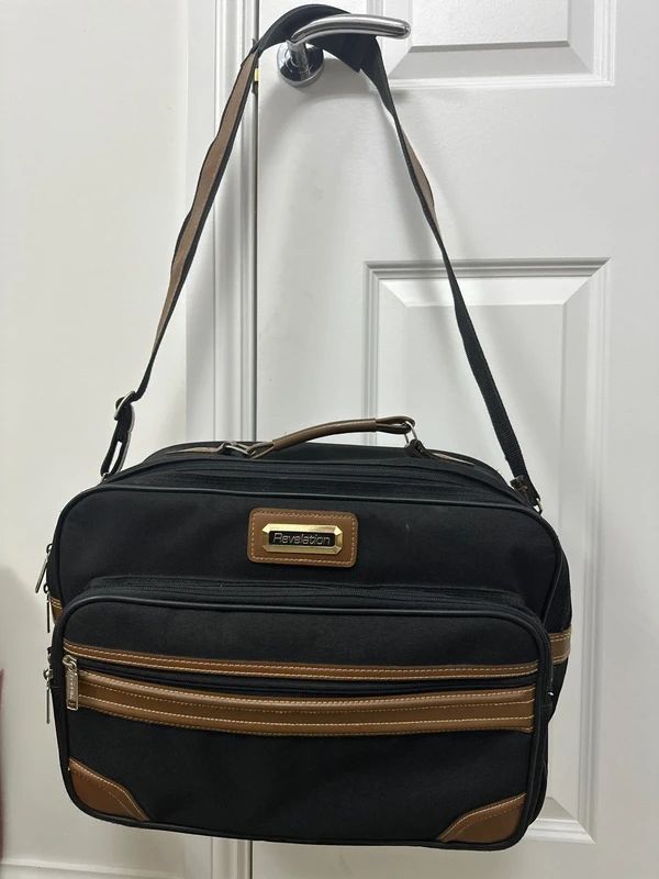Revelation black and brown travel holdall bag with a detachable shoulder strap