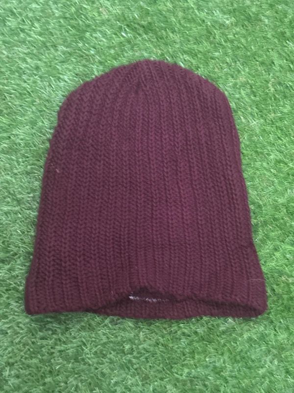 burgundy Love Your Melon beanie features a signature stitched leather logo patch