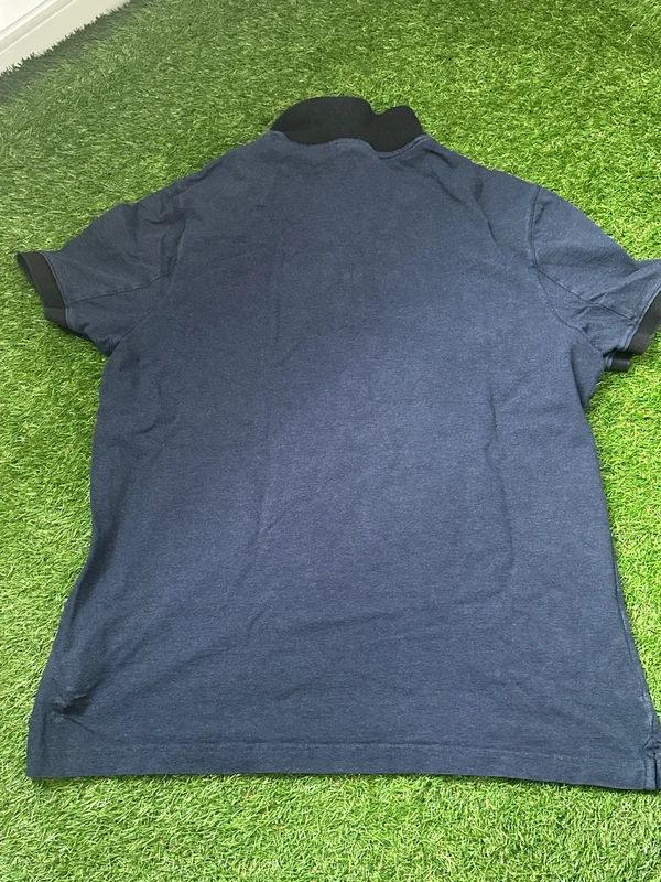 Calvin Klein navy blue polo shirt, embroidered logo on the chest. Mens Large