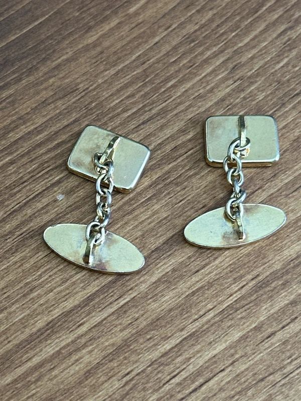 vintage 1970s cufflinks feature a distinct striped design on the face