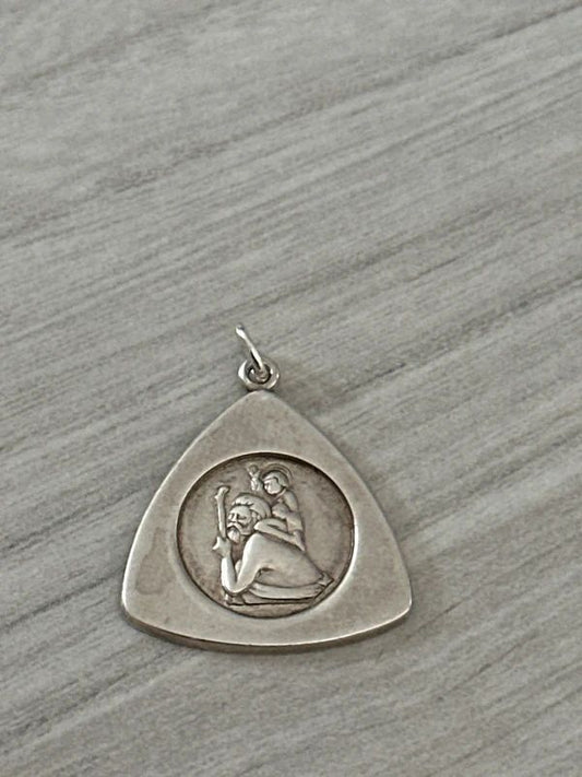 vintage sterling silver St. Christopher pendant features a rare triangular shape